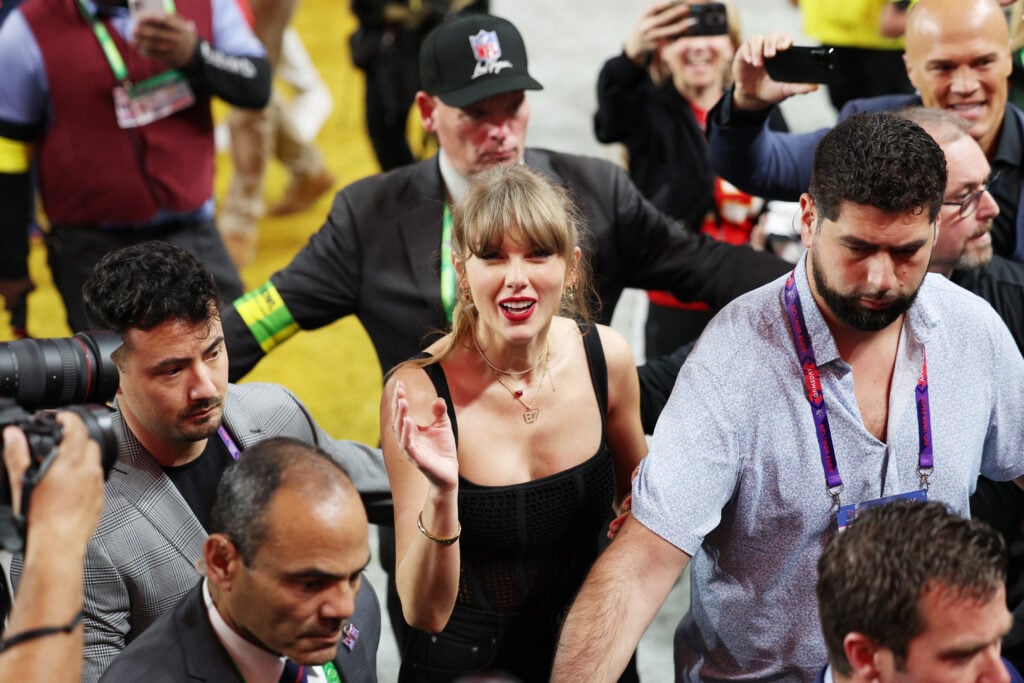 Taylor Swift with her security at the Super Bowl.