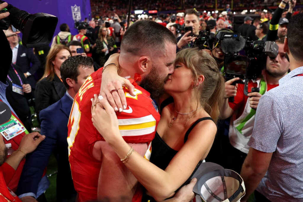 Taylor Swift and Travis Kelce kiss on February 11, 2024 at the Super Bowl.