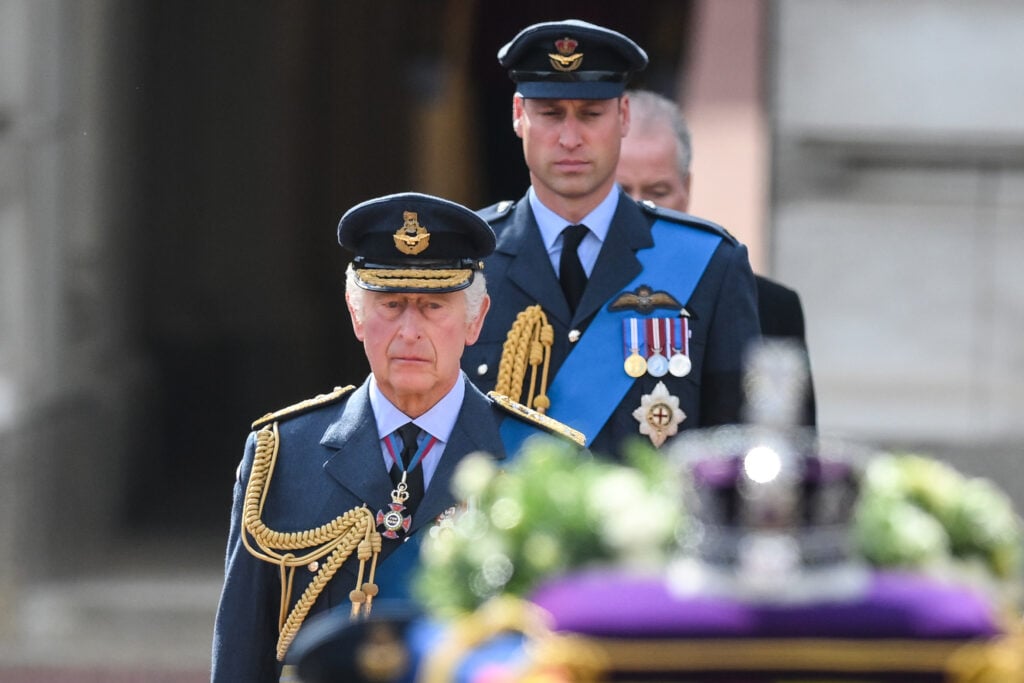 King Charles III and Prince William, Prince of Wales walk behind the carriage carrying the coffin of the late Queen Elizabeth II as they leave Buckingham Palace, transferring the coffin to the Palace of Westminster on September 14, 2022 in London, United Kingdom United.