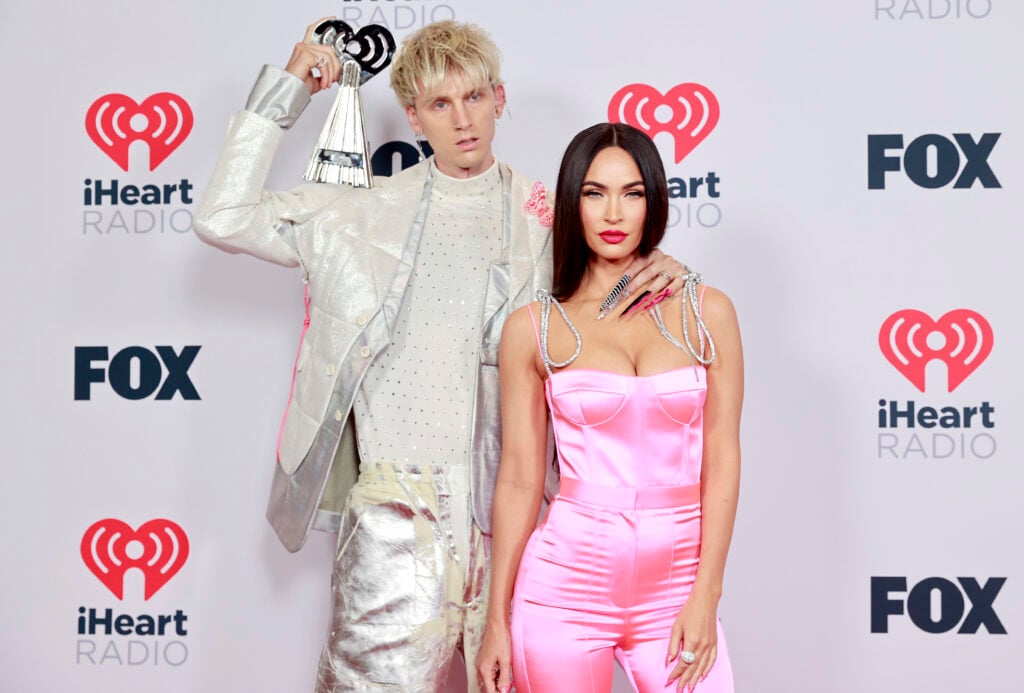 Machine Gun Kelly, winner of Alternative Rock Album of the Year for 'Tickets To My Downfall', and Megan Fox attend the 2021 iHeartRadio Music Awards at The Dolby Theater in Los Angeles, California, which was broadcast live on FOX on 27 May 2021. 
