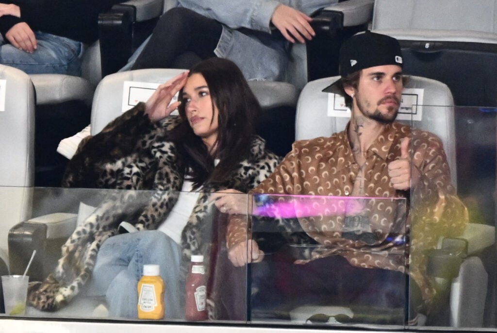 Justin Bieber and his wife, American model Hailey Bieber, watch Super Bowl LVIII between the Kansas City Chiefs and San Francisco 49ers at Allegiant Stadium in Las Vegas, Nevada, February 11, 2024. 