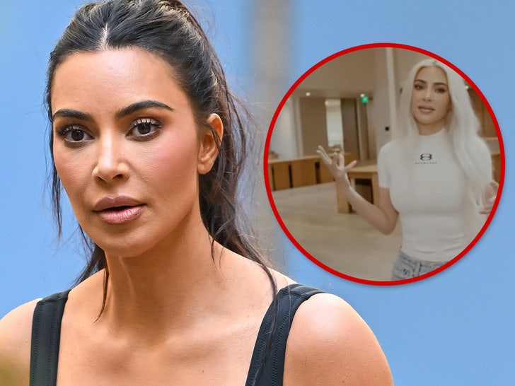 Kim Kardashian wearing a white shirt at the SKKN office.