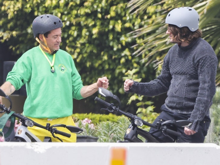 Robert Downey rides a bike with his 2nd son