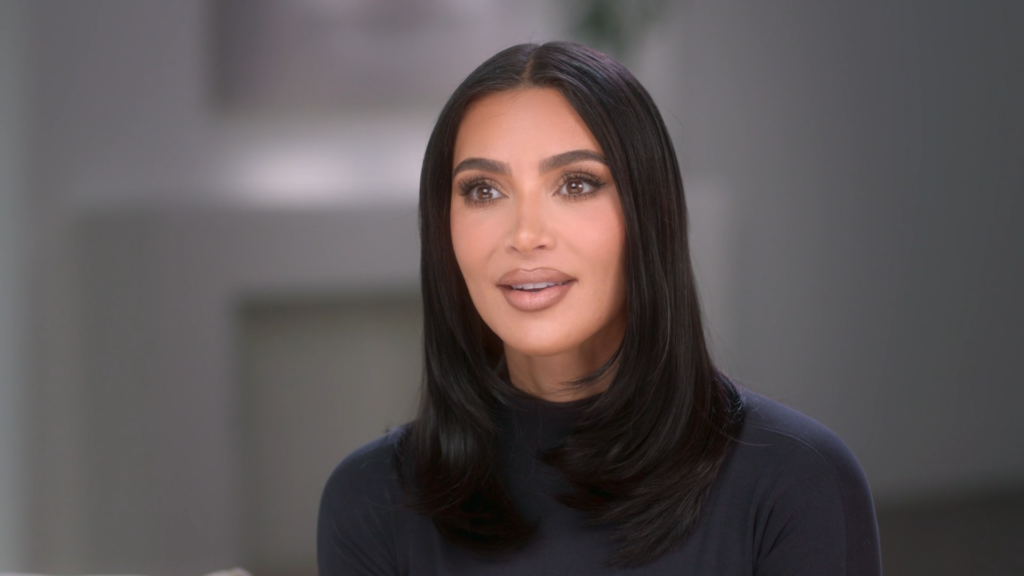 Kim Kardashian wears all black while speaking to the camera confessional on The Kardashians in 2023.