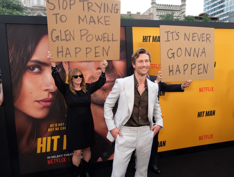 Prank LANGUAGE: At the premiere of his film “Hit Man” in Austin, Texas, Glen Powell's parents prank their son with cardboard.