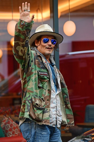 TREASURE NOTICED: In central London, Johnny Depp takes style notes from his character, Captain Jack Sparrow.