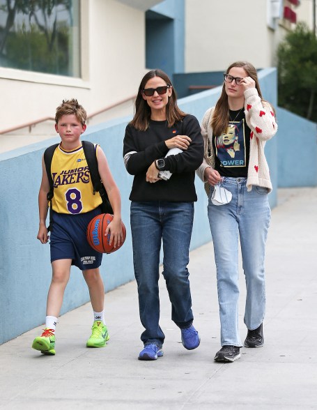 HOME TEAM: Jennifer Garner (center) and daughter Violet, 18, are ready to cheer on her son and brother Samuel, 12.