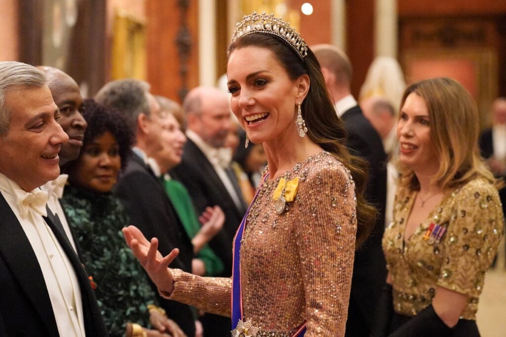 Kate Middleton on December 5, 2023, wearing gold.