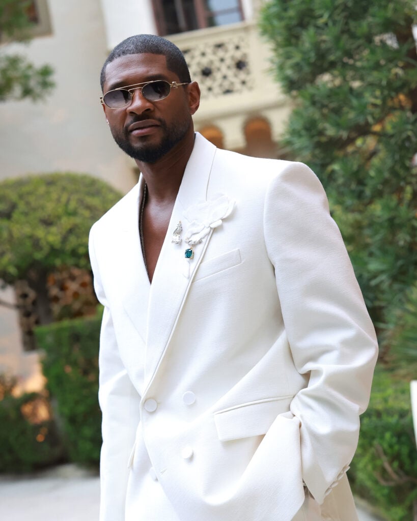 Usher in April 2024 wearing all white.