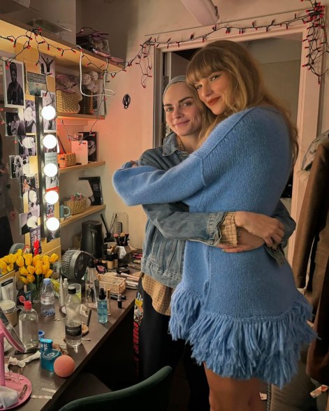 BUDDY SYSTEM: Best friend to the rescue!  In London, Taylor Swift (right) visits Cara Delevingne backstage at one of Cara's final “Cabaret” performances.