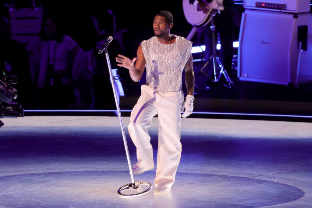 Usher performs on stage during the Apple Music Super Bowl LVIII Halftime Show at Allegiant Stadium on February 11, 2024 in Las Vegas, Nevada. 