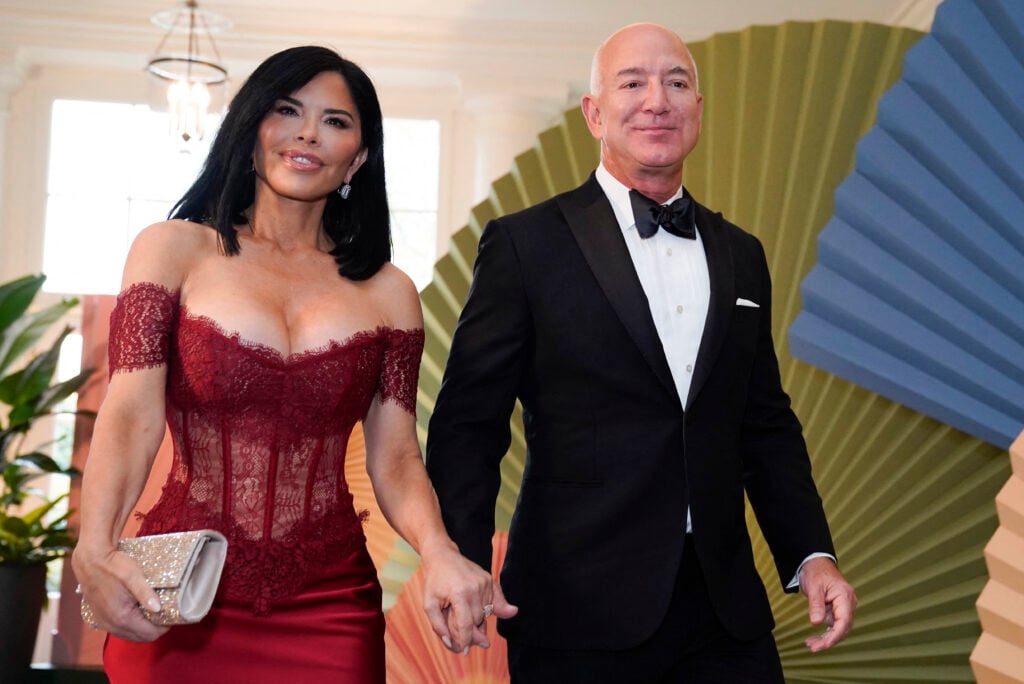 Amazon Chief Executive Jeff Bezos and actress Lauren Sanchez arrive for a state dinner honoring Japanese Prime Minister Fumio Kishida in the Booksellers Room of the White House in Washington, D.C., April 10, 2024. 