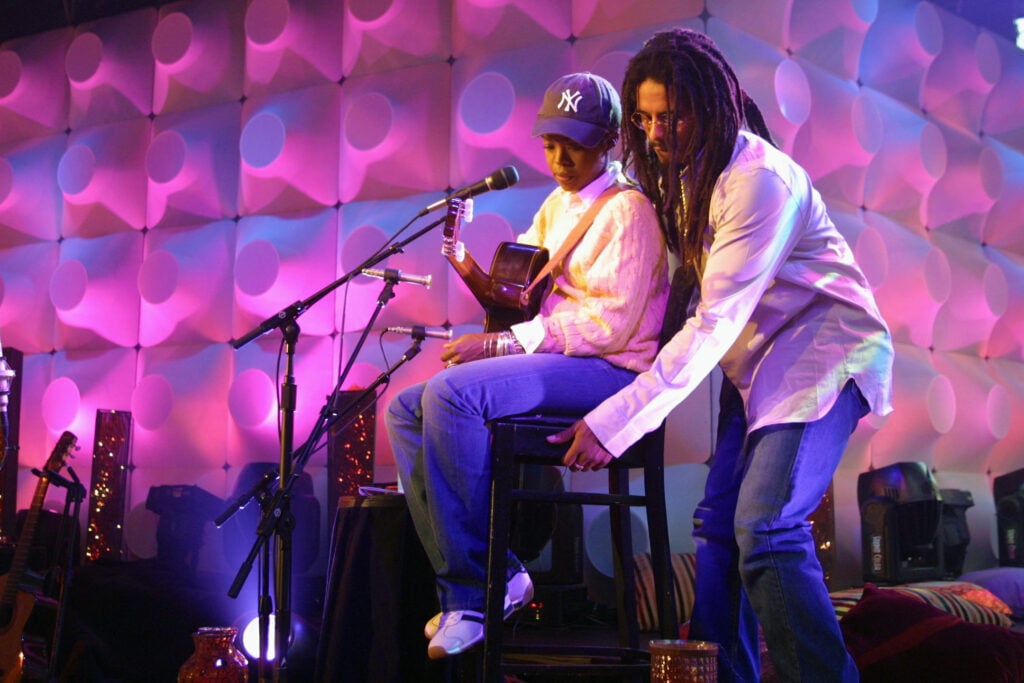 Rohan Marley, Bob Marley's son, helps his wife, Lauryn Hill, during 'MTV Unplugged' rehearsals at the MTV studios in New York, 7/21/01. 