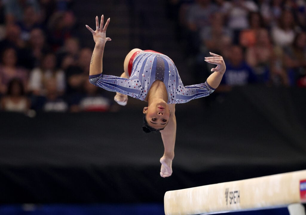 Suni Lee flies through the air on June 30, 2024.