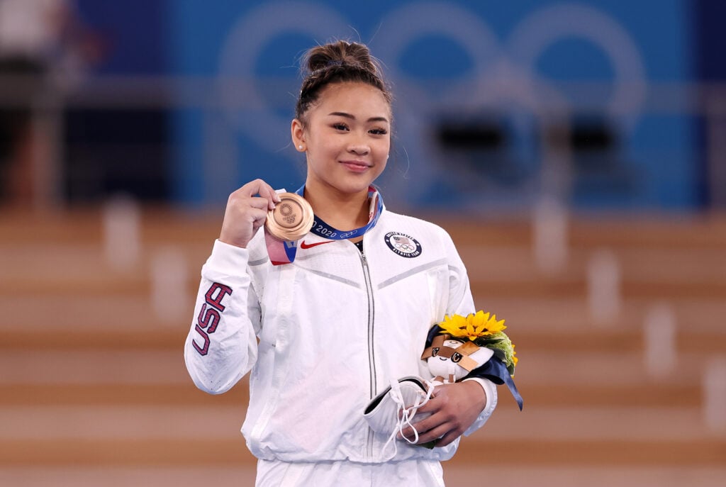 Bronze medalist Sunisa Lee of Team USA poses with her medal on the podium during the awards ceremony for the women's uneven bars final on day nine of the Tokyo 2020 Olympic Games at Ariake Gymnastics Center on August 1, 2021 in Tokyo, Japan. 