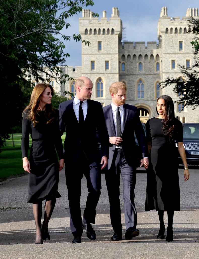 Catherine, Princess of Wales, Prince William, Prince of Wales, Prince Harry, Duke of Sussex, and Meghan, Duchess of Sussex, on the Long Walk at Windsor Castle, arrive to view flowers and tributes to Queen Elizabeth on September 10, 2022 in Windsor, England. 