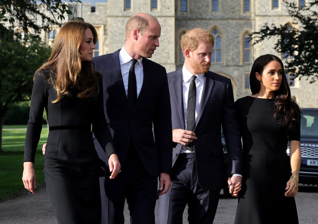 Catherine, Princess of Wales, Prince William, Prince of Wales, Prince Harry, Duke of Sussex, and Meghan, Duchess of Sussex, on the Long Walk at Windsor Castle, arrive to view flowers and tributes to Queen Elizabeth on September 10, 2022 in Windsor, England. 