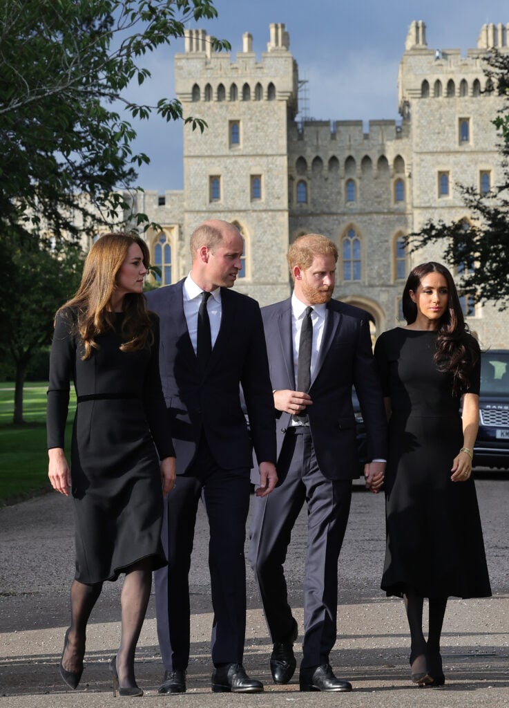 Catherine, Princess of Wales, Prince William, Prince of Wales, Prince Harry, Duke of Sussex, and Meghan, Duchess of Sussex, on the Long Walk at Windsor Castle, arrive to view flowers and tributes to Queen Elizabeth on September 10, 2022 in Windsor, England. 
