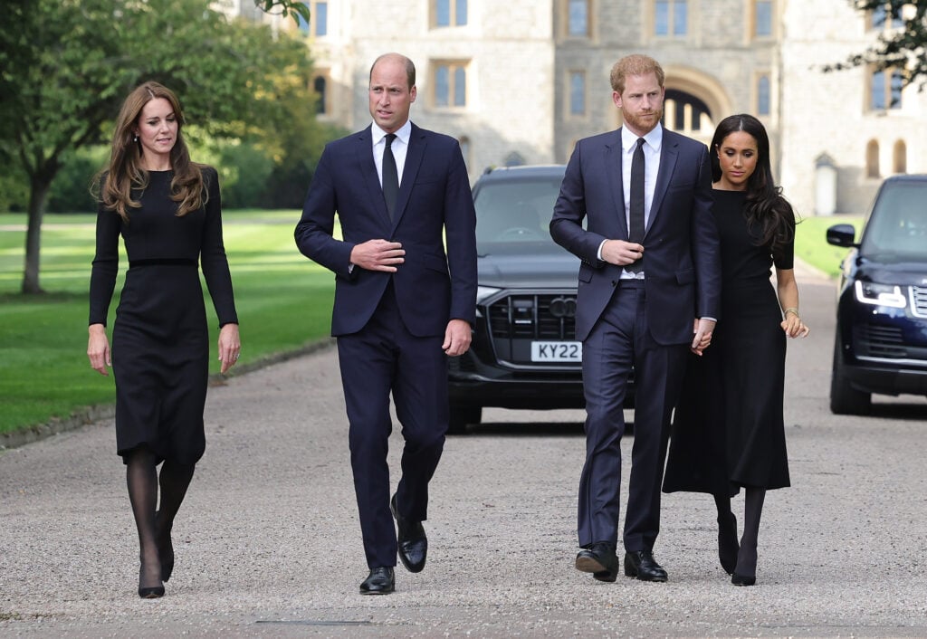 Catherine, Princess of Wales, Prince William, Prince of Wales, Prince Harry, Duke of Sussex, and Meghan, Duchess of Sussex, on the Long Walk at Windsor Castle, arrive to view flowers and tributes to Queen Elizabeth on September 10, 2022 in Windsor, England.