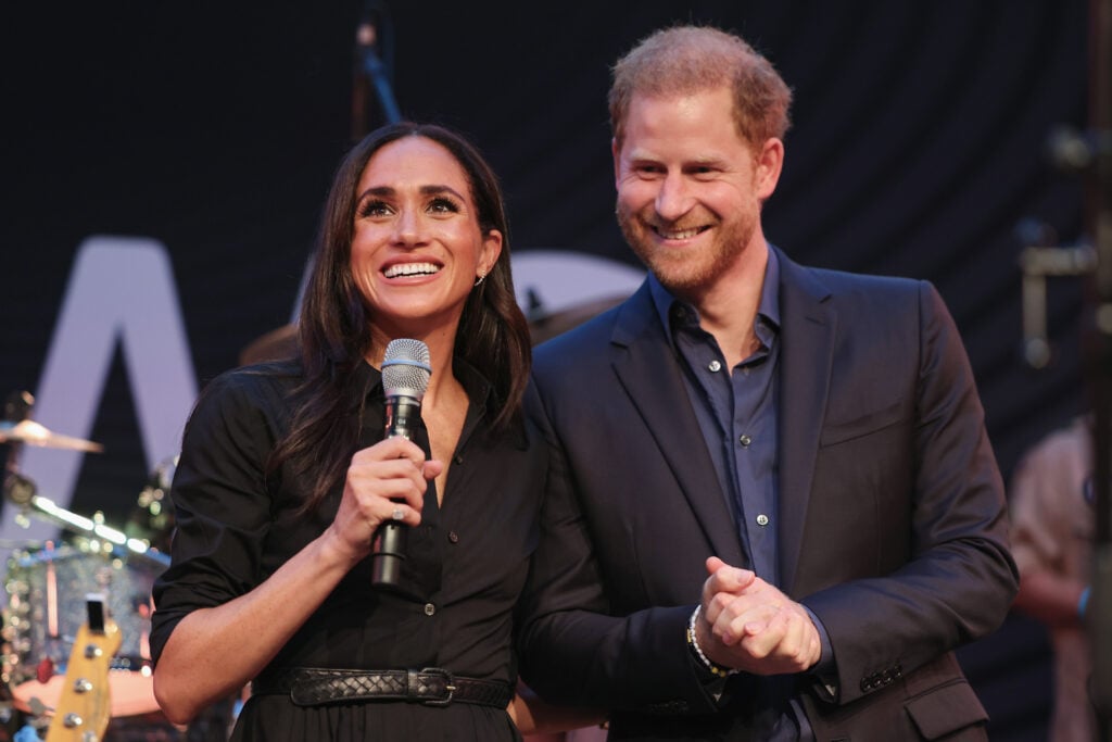 Prince Harry, Duke of Sussex and Meghan, Duchess of Sussex speak on stage at the 