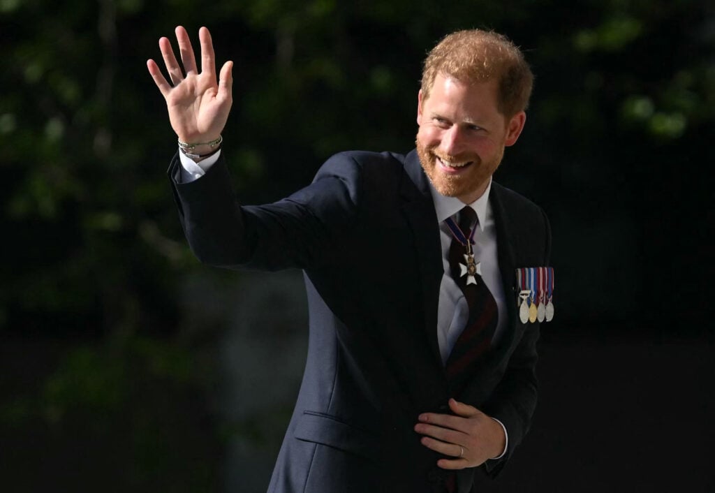 Prince Harry, Duke of Sussex, waves as he arrives to attend a ceremony marking the 10th anniversary of the Invictus Games at St Paul's Cathedral in central London on May 8, 2024. 