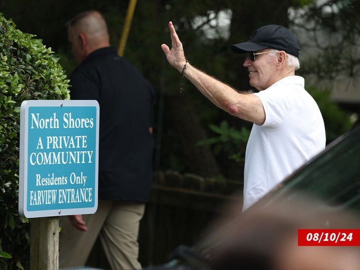 joe biden waving submarine from beach