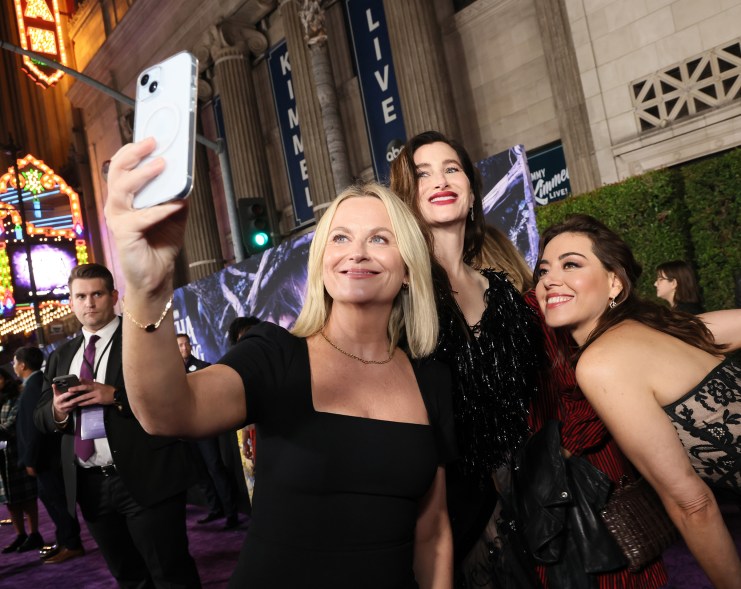 'RECREATION' SEASON: Amy Poehler (L-R) hits the red carpet at “Agatha All Along” in Los Angeles to support “Parks and Recreation” castmates Kathryn Hahn and Aubrey Plaza.