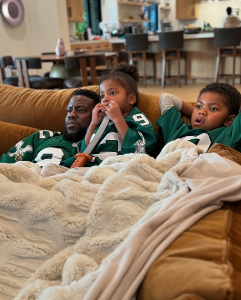 EAGLES' NESTING PLACE: Kevin Hart keeps his 3-year-old daughter, Kaori, and 6-year-old son, Kenzo, close by while watching the Philadelphia Eagles.