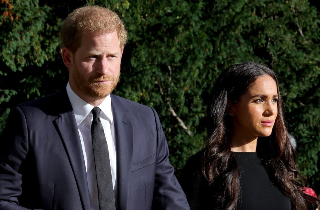 Prince Harry, Duke of Sussex, and Meghan, Duchess of Sussex on the long walk at Windsor Castle arrive to view flowers and pay tribute to Her Majesty Queen Elizabeth on September 10, 2022 in Windsor, England. 