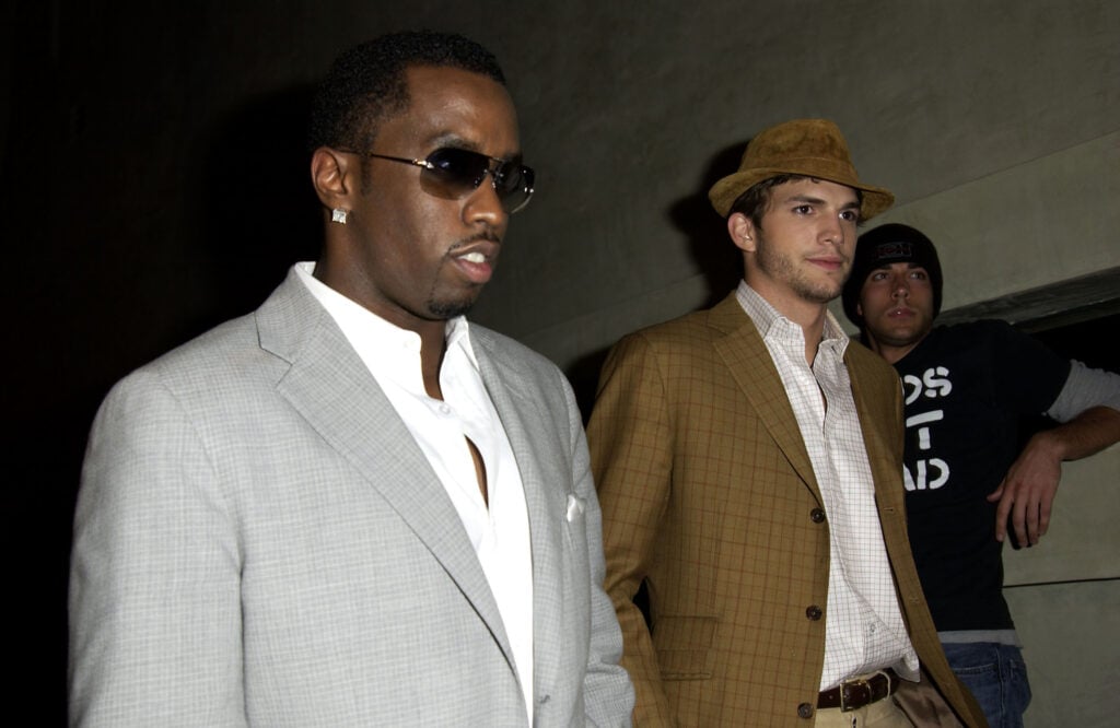 Actor Ashton Kutcher and producer Sean "P Diddy" Combs frequents Kutcher &; Endeavor MTV Movie Awards launch party at Dolce Restaurant on May 30, 2003 in West Hollywood, California. 