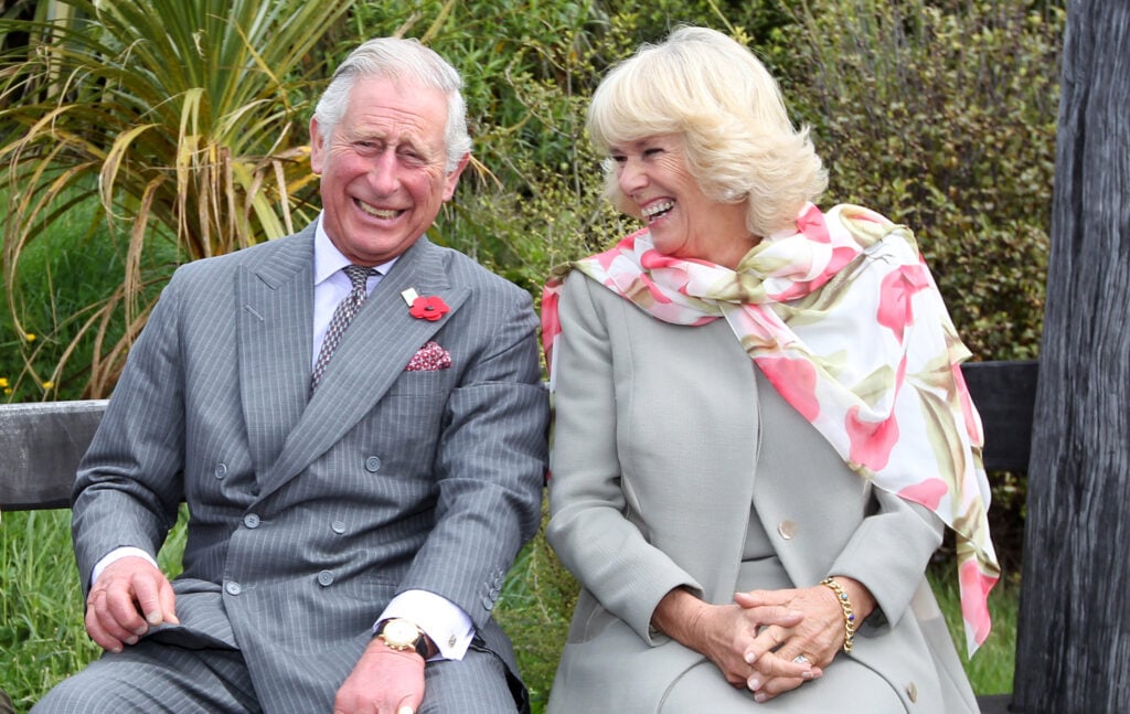 Prince Charles, Prince of Wales and Camilla, Duchess of Cornwall, continue to laugh after a bubble bee liked Prince Charles during his visit to the Orokonui Ecosanctuary on November 5, 2015 in Dunedin, New Zealand.