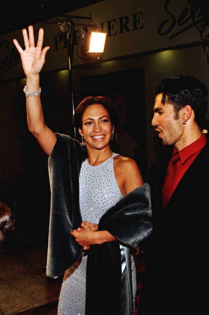 Jennifer Lopez waves to fans as she arrives with husband Ojani Noa for the film's world premiere 